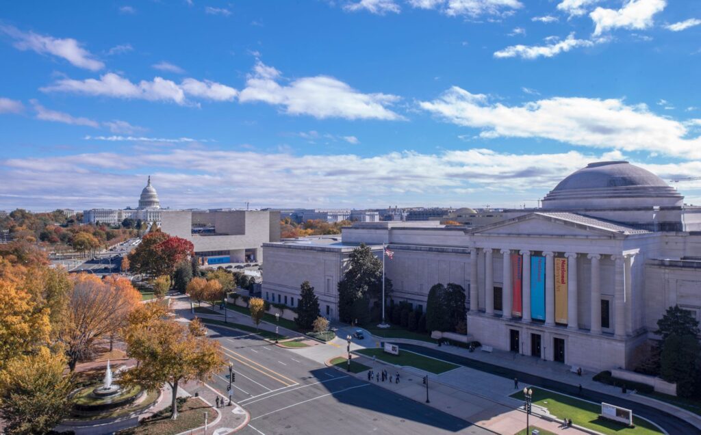 Washington D.C. skyline featuring the Capitol Building and National Gallery of Art under a blue sky. Skylight Glass view | American Glass and Door